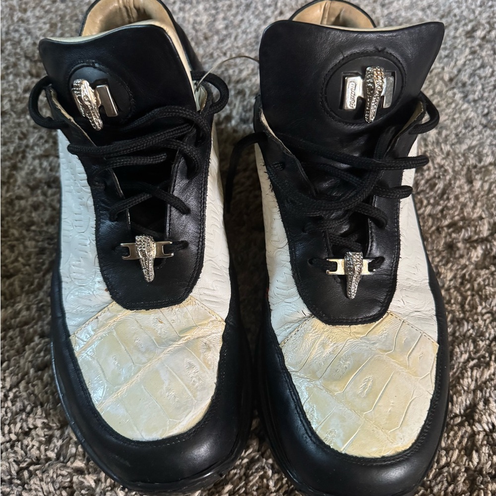 Mauri’s alligator sneakers.  With original box.